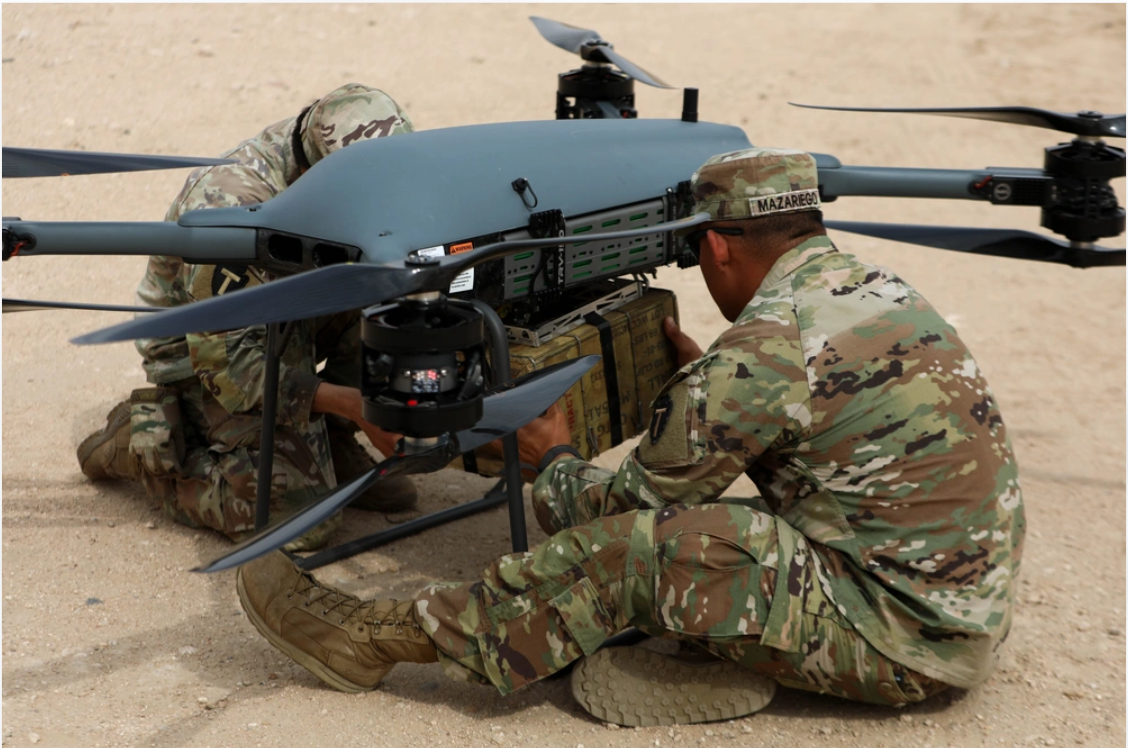 U.S. Army soldiers attach supplies to a TRV-150 resupply drone during a training event in the U.S. Central Command area of responsibility, April 10, 2025. Photo: U.S. Army / Sgt. Alison Strout.